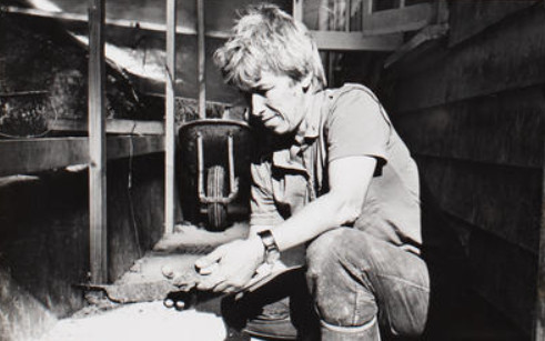 Photograph: Joan Maingay with archaeological finds, Pompallier House - New Zealand Maritime Museum